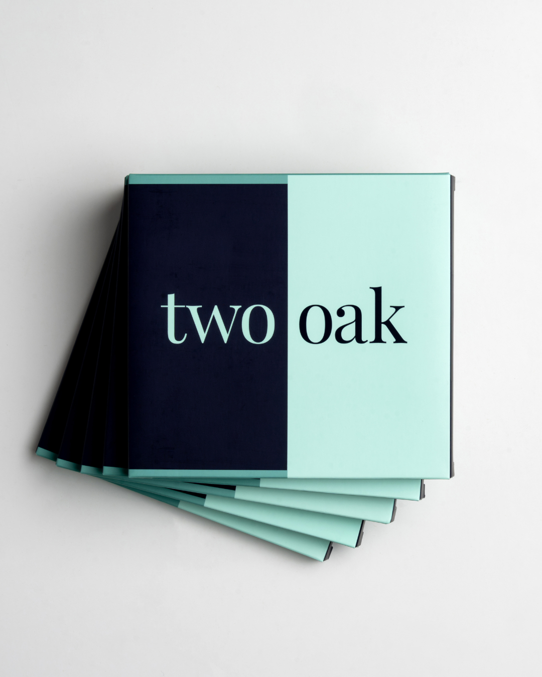 A single green leaf against a white background.