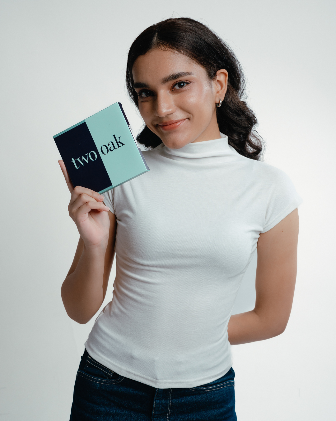 A single green leaf against a white background.